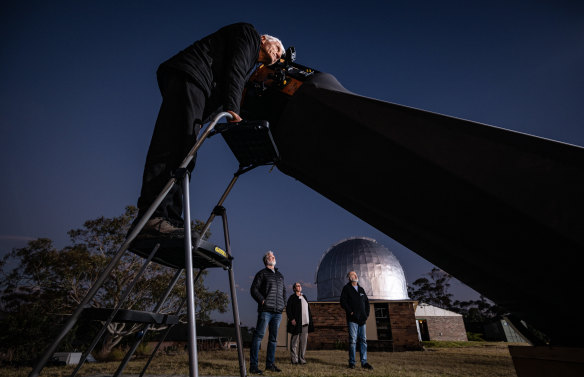 Western Sydney Amateur Astronomy Group vice president Rob Horvat searches the night sky with other astronomers.