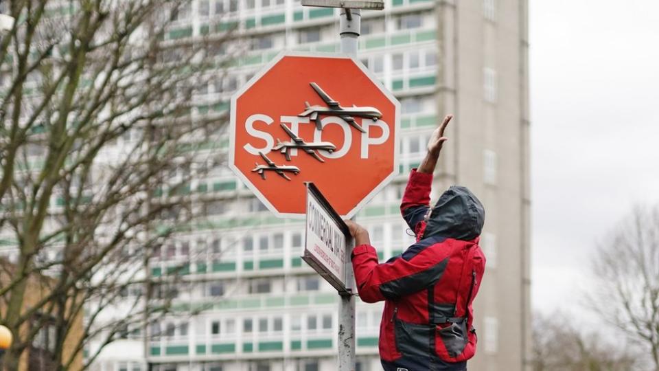 London onlookers watched as man removed Banksy art