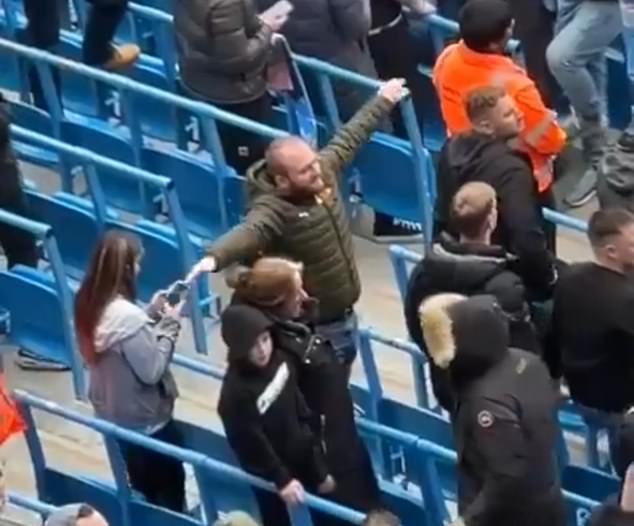 Fan is arrested by GMP for aeroplane gesture at Man United supporters