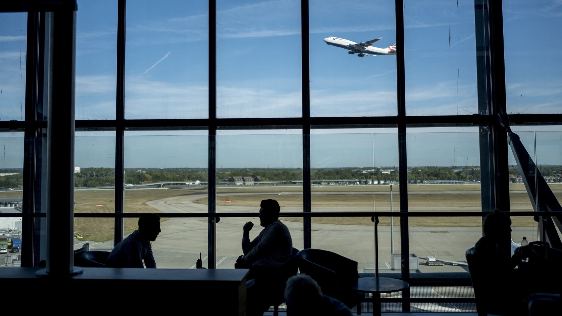 Passengers wait for their flights at Heathrow Airport’s Terminal 5 